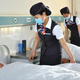 Illustration for article titled Nurses Cosplay as Flight Attendants at a Chinese Hospital
